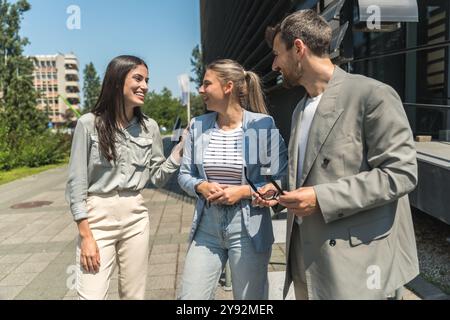 Group of young businesspeople stock market and exchange experts, leaders in modern science, finance and economy standing outside of office building. S Stock Photo