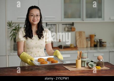 Housewife Baking Cakes In The Kitchen Stock Photo