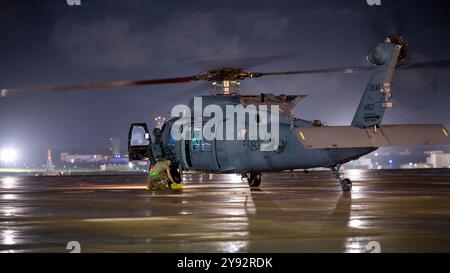 A U.S. Air Force HH-60W Jolly Green II assigned to the 33rd Rescue Squadron land at Kadena Air Base, Japan, on Sept. 23, 2024. The integrated training Stock Photo