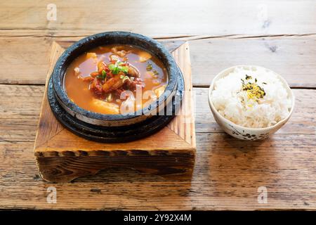 Spicy Korean style Kimchi and Pork Soup and boiled rice Stock Photo