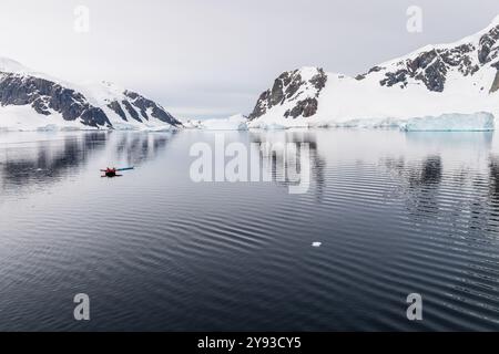 Danco Island, Antarctic Peninsula - January 31, 2024. Crew members of the Atarctic Exploration vessel Ocean Adventurer prepare zodiacs for explorations of Danco Island and its surroundings in the Antarctic Peninsula. Stock Photo