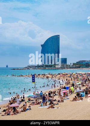 Barceloneta, Barcelona nude beach with W Hotel, Spain Stock Photo - Alamy