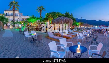 View of restaurant on beach after sunset, Thassos Town, Thassos, Aegean Sea, Greek Islands, Greece, Europe Stock Photo