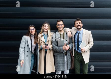 Group of young businesspeople stock market and exchange experts, leaders in modern science, finance and economy standing outside of office building. S Stock Photo