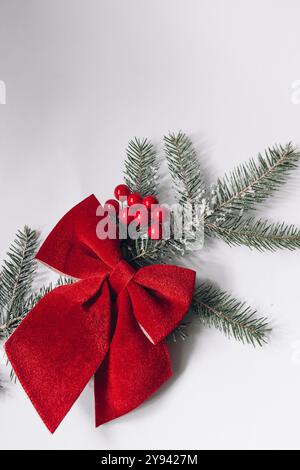 Christmas composition. Red Christmas tree toy with a fir branch on a white background. Stock Photo