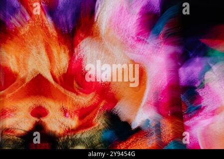 A vivid and dynamic abstract artwork showcasing bright reds, oranges, pinks, and purples. The image conveys a sense of movement and creativity through Stock Photo