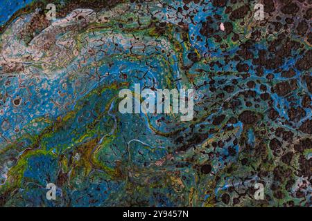 An abstract close-up photo showcasing a blue and green pattern with intricate textures. The marbled effect and color contrast create a rich visual int Stock Photo