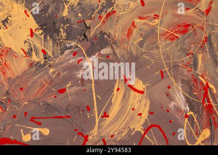 An abstract painting featuring a dynamic mix of brown, red, and beige colors. The textured layers and splatters create an energetic and vibrant compos Stock Photo