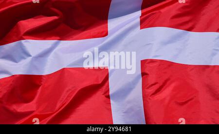 The flag of Denmark flutters in the wind Stock Photo