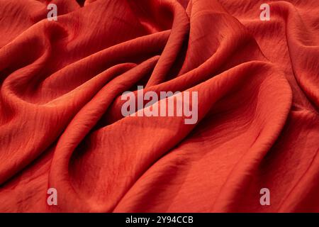Close-up of luxurious red fabric with soft folds and texture Stock Photo