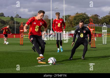 PONTYCLUN, WALES - 07 OCTOBER 2024: Wales' Connor Roberts and Wales’ Masseur Chris Senior during a Wales training Session at the Vale Resort ahead of Stock Photo