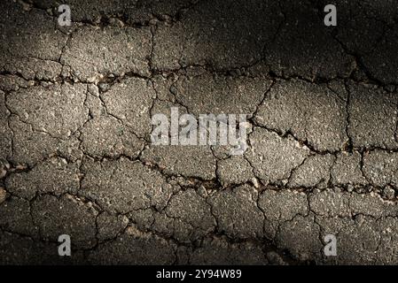 Cracked asphalt texture. Top view. Asphalt. Road background Stock Photo