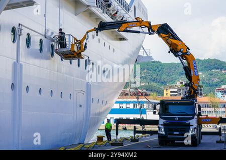 La Spezia, Italy - May 28, 2024: Cruise ship hull maintenance work while docked at the port quay Stock Photo