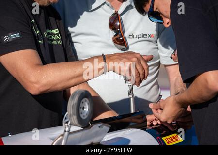 A group of men are working on a radio-controlled jet plane. Stock Photo