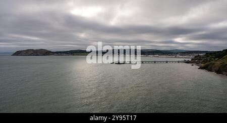 Llandudno Pier, the seafront and Little Orme's Head are seen from Pen-trwyn on the Great Orme in North Wales. Stock Photo