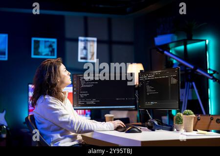 Freelancing computer scientist securing company servers from virus attacks using augmented reality tech. IT remote worker looking at AR visualization, writing code to build firewalls protecting data Stock Photo