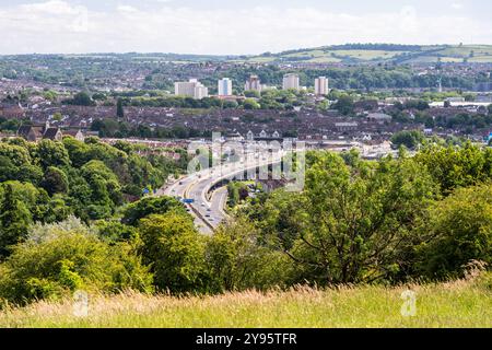 The cityscape of Bristol is laid out below Purdown hill, including the M32 motorway, houses of Eastville and Easton, and high rise tower blocks of Bar Stock Photo