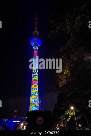 Berlin, Germany - October 6, 2024: Famous Berlin TV Tower (Fernsehturm) on Alexanderplatz illuminated with 3d mapping during annual Festival of Lights in Berlin Stock Photo