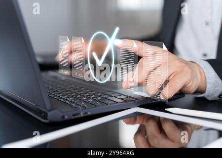 Businessman touching approved document icon on digital documents for approve business project proposals. Quality assurance and online evaluation of bu Stock Photo
