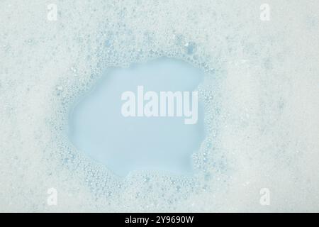 Washing laundry. Water with foam, top view Stock Photo