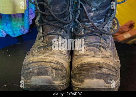 Close-up of old worn and dirty leather Royer brand steel tip toe work boots. Stock Photo