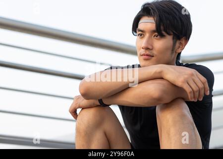 Young man sitting on the steps Stock Photo