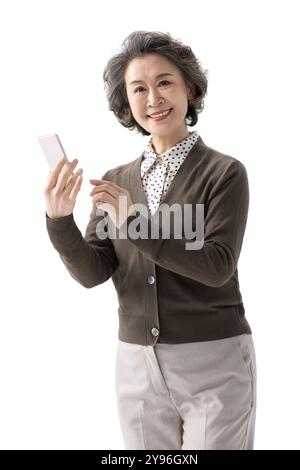 Happy senior woman using smart phone Stock Photo
