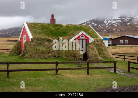 Lindarbakki Turf House in Borgarfjordur-Eystri in East Iceland, traditional Icelandic red house overgrown with grass and turf. Stock Photo