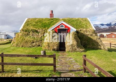 Lindarbakki Turf House in Borgarfjordur-Eystri in East Iceland, traditional Icelandic red house overgrown with grass and turf. Stock Photo