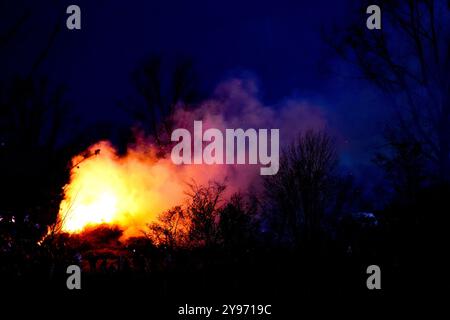 Big fire at night. Fire in nature. Easter fire. Clouds of smoke. Stock Photo