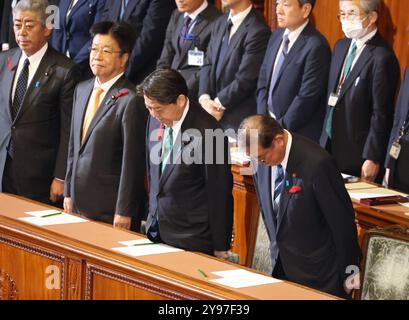 Tokyo, Japan. 9th Oct, 2024. Japanese Prime Minister Shigeru Ishiba (R) accompanied by Chief Cabinet Secretary Yoshimasa Hayashi (2nd R), Finance Minister Katsunobu Kato (2nd L) and Foreign Minister Takeshi Iwaya (L) bows his head as he dissolved Lower House at Lower House's plenary session at the Natkional Diet in Tokyo on Wednesday, October 9, 2024. Japan's general election will be held on October 27. (photo by Yoshio Tsunoda/AFLO) Stock Photo