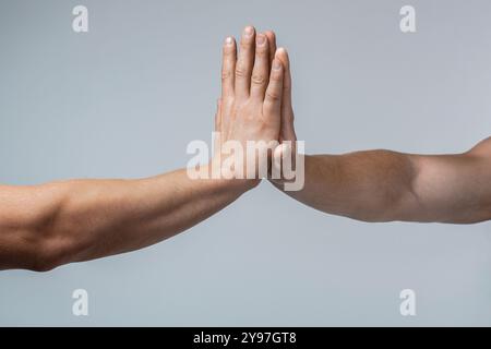 Close up of two hand show high five hand when people work done complete success project with teamwork office business. Male and female hand together Stock Photo