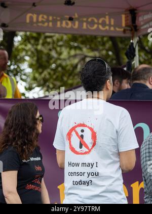 Melbourne, Australia. 05th Oct, 2024. An attendee wears a shirt saying 'How may I censor you today?' during the rally. The Australian Libertarian Party held a public rally at Flagstaff Gardens espousing party policy; particularly opposition to the federal government's proposed Communications Legislation Amendment (Combatting Misinformation and Disinformation) Bill 2024, and the state of Victoria's proposed changes to anti-vilification laws. (Photo by Alex Zucco/SOPA Images/Sipa USA) Credit: Sipa USA/Alamy Live News Stock Photo