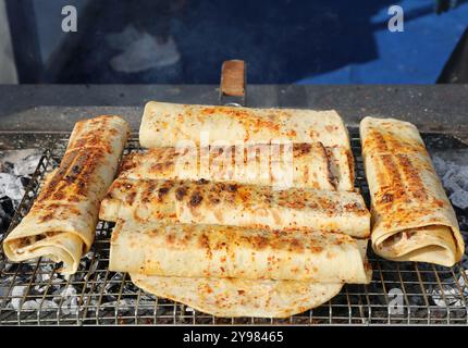 Antakya Style Chicken Doner Kebab Wraps getting  grilled for customers at  Food Festival in Adana, Turkey Stock Photo