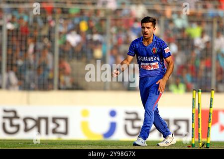 Fazalhaq Farooqi celebrates one of his three wickets along teammates during Bangladesh and Afghanistan second T20 match of two match series at the She Stock Photo