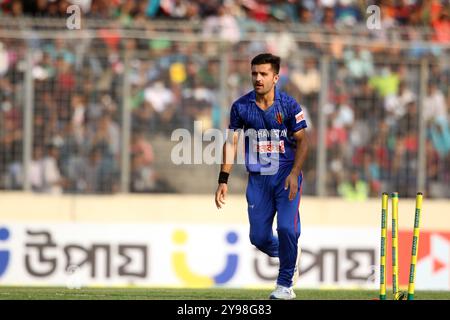 Fazalhaq Farooqi celebrates one of his three wickets along teammates during Bangladesh and Afghanistan second T20 match of two match series at the She Stock Photo