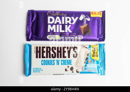 London, United Kingdom, 30th September 2024:- A view of the Cadbury’s confectionary Dairy Milk & Harshey's Cookies 'N' Creme, against a white backgrou Stock Photo