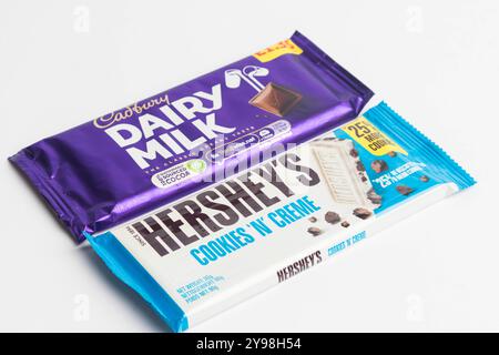 London, United Kingdom, 30th September 2024:- A view of the Cadbury’s confectionary Dairy Milk & Harshey's Cookies 'N' Creme, against a white backgrou Stock Photo