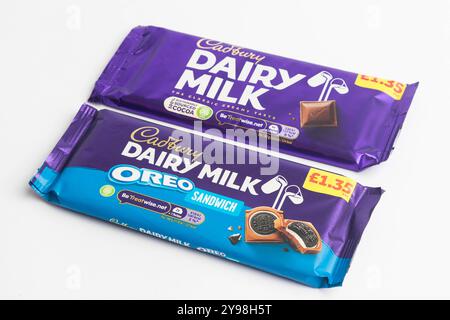 London, United Kingdom, 30th September 2024:- A view of the Cadbury’s confectionary Dairy Milk and Dairy Milk Oreo,  against a white background Stock Photo