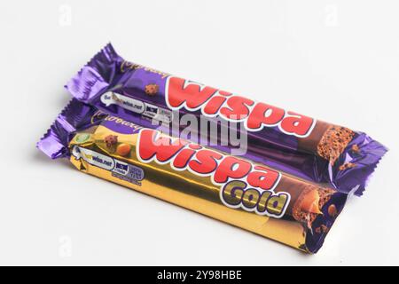 London, United Kingdom, 30th September 2024:- A view of the Cadbury’s confectionary Wispa and Wispa Gold, against a white background Stock Photo