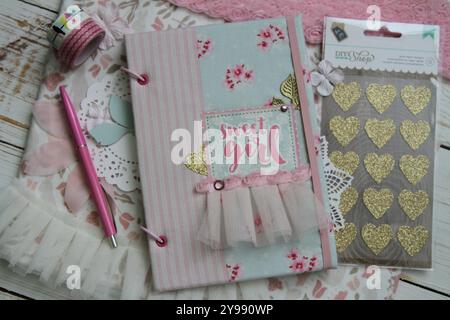 Scrapbooking handmade textile baby book and accessories Stock Photo