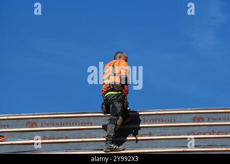 man working on a roof Stock Photo