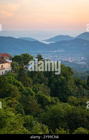 Scenic view of the Ligurian coast at sunset from a height about 8 miles inland near the medieval town of Fosdinovo, northern Tuscany, Italy. Stock Photo