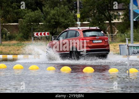 ODESSA, UKRAINE-September 5,2024: After heavy rains, traffic jams formed on roads, cars are doused with water and stall. Cars float in puddles on the Stock Photo