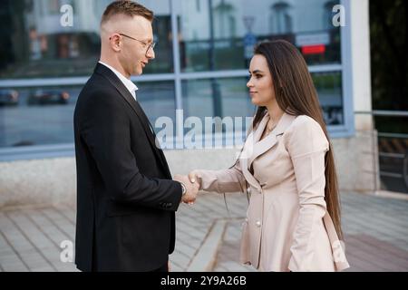 Elegant Business Meeting between Two Professionals in an Urban Setting. Stock Photo