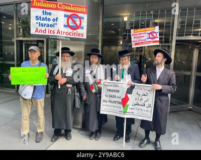 A coalition of peace groups including a group of Orthodox Jewish Rabbis demonstrte on 3rd Avenue at the South African Consulate in NYC and call for a ceasefire in Gaza and for the Israeli army to stop killing civilians. Later they marched to the Israeli Consulate and then to the United Nations. Stock Photo