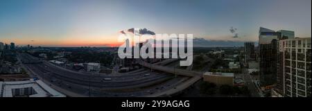 180 degree Aerial panorama view of Atlanta freeway with heavy traffic on a Sunday evening shot during golden hour Stock Photo