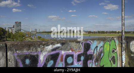 Panorama from the graffiti painted south bridge over the southern Rheinau harbour, the Rhine and the Deutz district on the right bank of the Rhine, Co Stock Photo