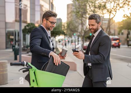 Businessmen working online. Businessmen colleague in suit with phone. Online working. Businessmen checking business chat. Business men freelancing Stock Photo