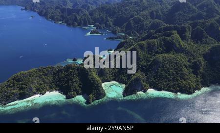 Aerial view of tropical Coron island in Philippines. Blue lagoons and lakes, white sand beach, rocks cliffs mountains and beautiful coral reef Stock Photo